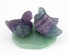 Fluorite ducks on aventurine leaf