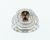 Demantoid color-change garnet and diamond ring