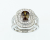 Demantoid color-change garnet and diamond ring Demantoid color-change garnet and diamond ring